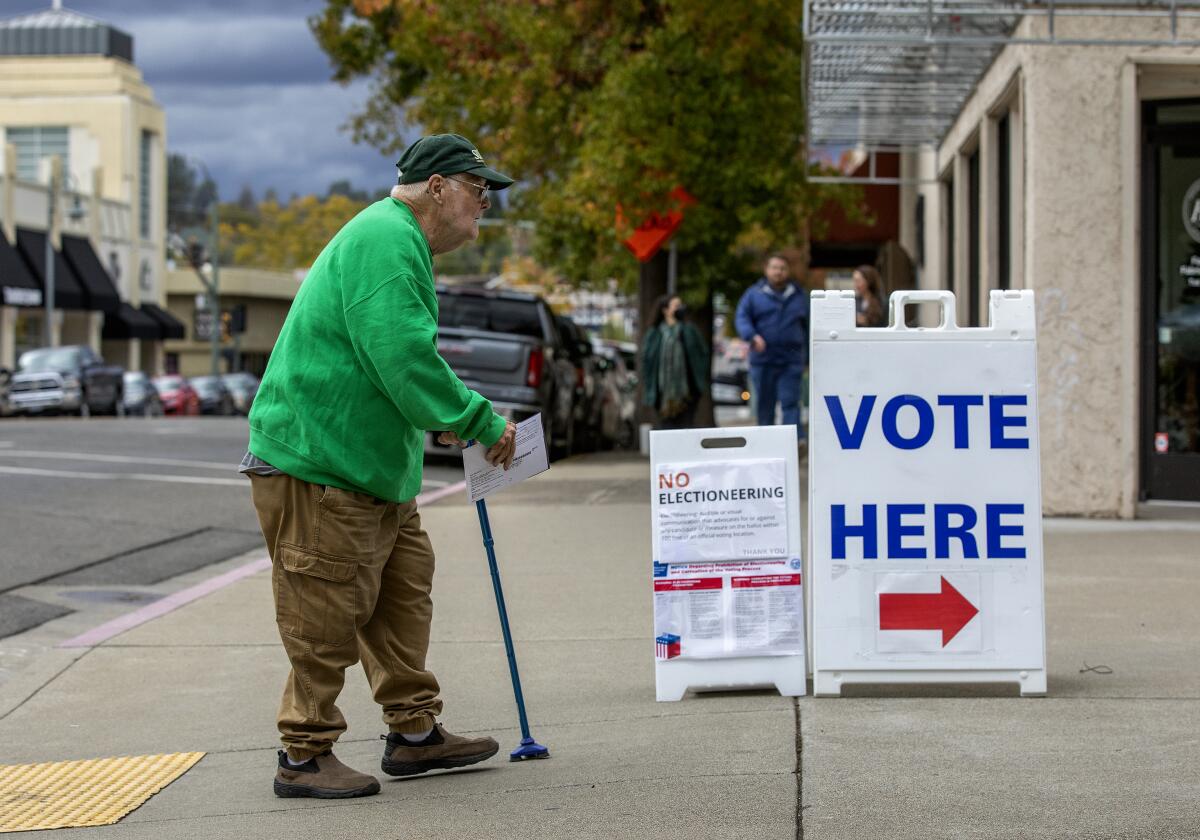 Michael Sullivan, 83, makes his way to the Shasta County elections office in Redding, Calif. 