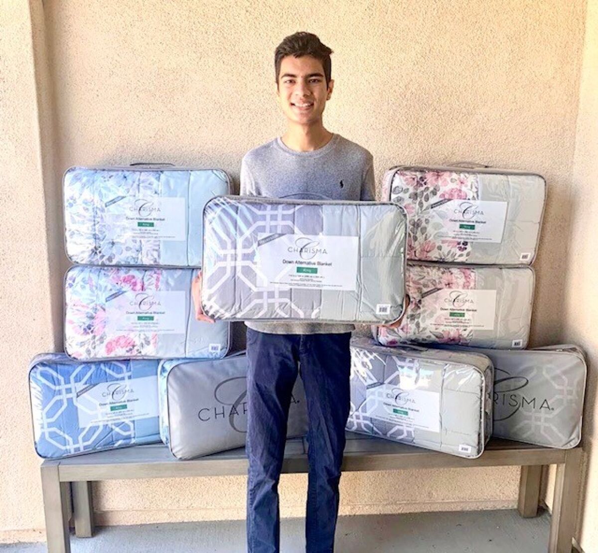 Jaiv Doshi brings a donation of quilts to the La Posada shelter in Carlsbad during the pandemic.