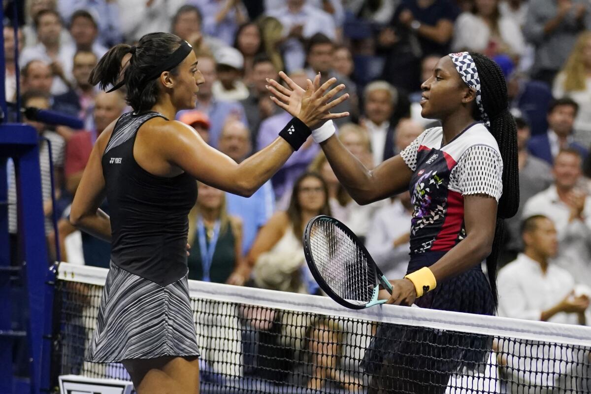 Caroline Garcia shakes hands with Coco Gauff.