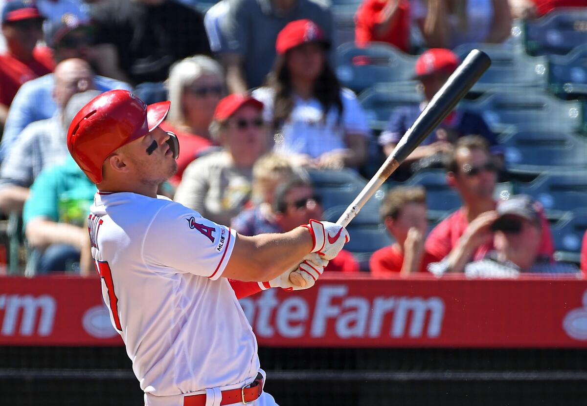 The Angels' Mike Trout watches the flight of his grand slam home run April 6 in the fourth inning against the Texas Rangers.