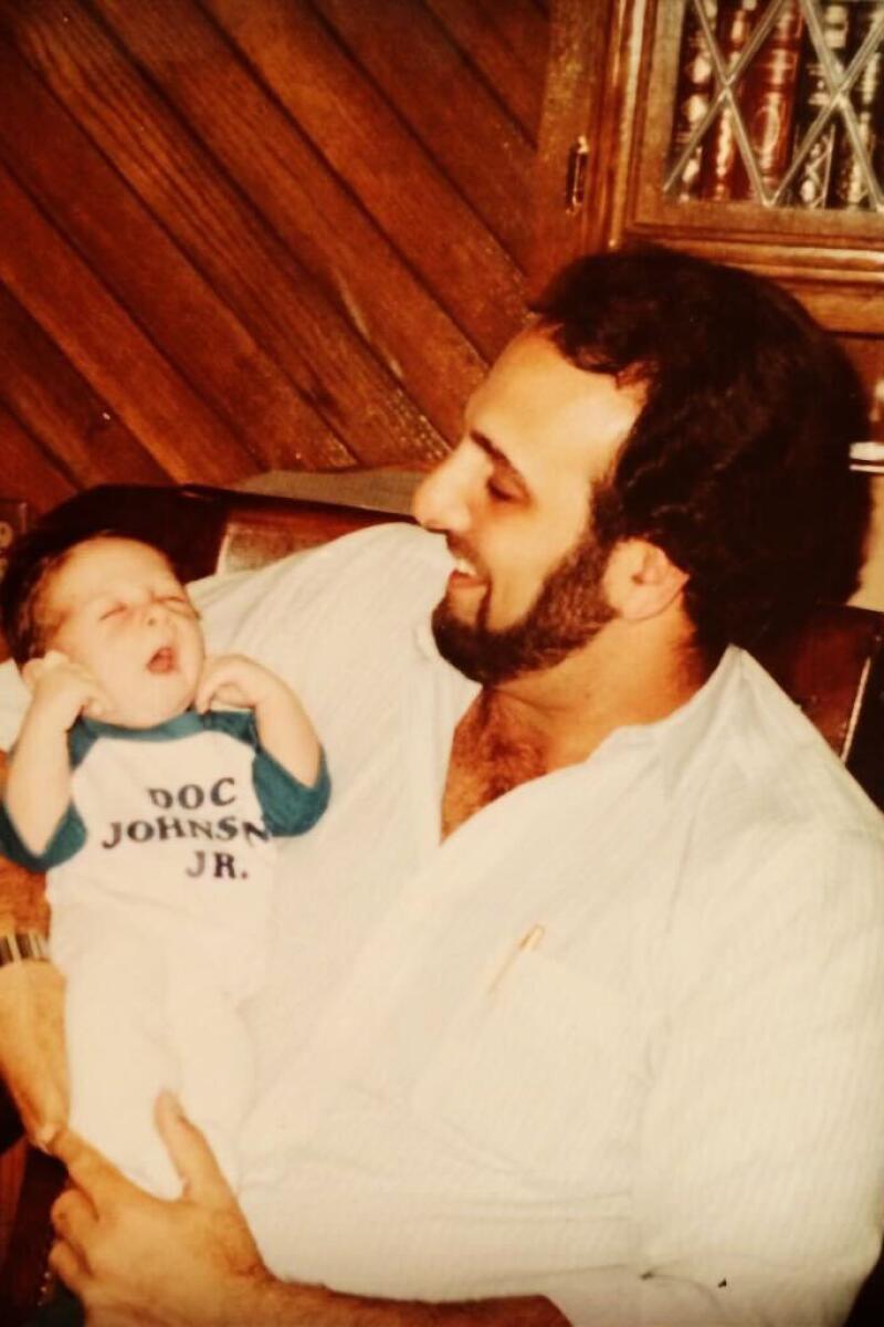 Ron Braverman holds his son, Chad, in his office at Doc Johnson in the early 1980s. 