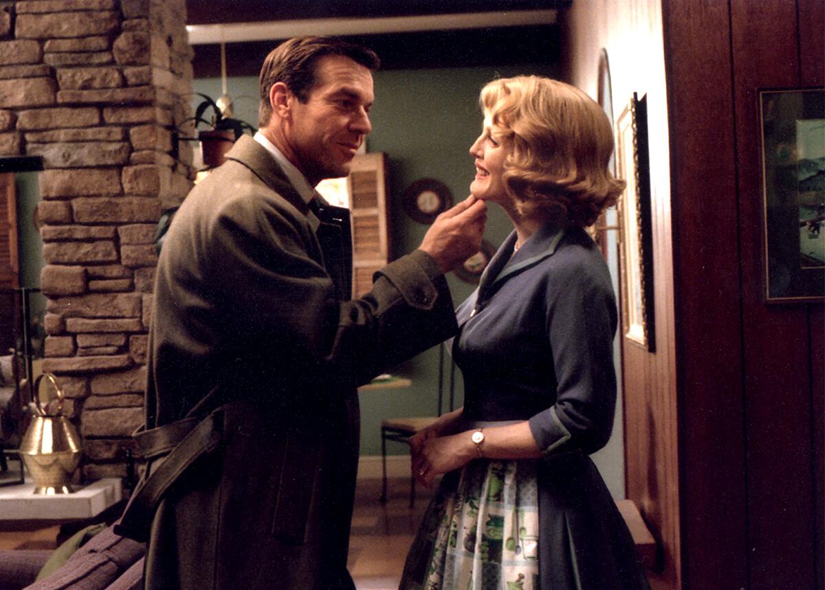 Dennis Quaid touches Julianne Moore's chin in a scene from "Far From Heaven."