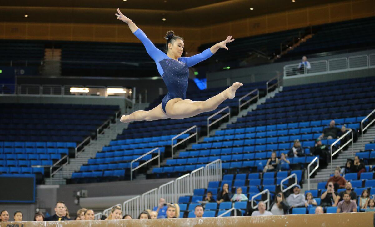 Kyla Ross, who won gold medal in the team competition at the 2012 Summer Olympics, performs on the balance beam during the UCLA gymnastics exhibition at Pauley Pavilion on Saturday.