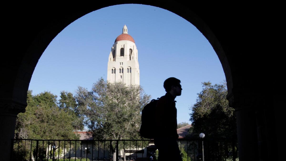 A student walks in front of Hoover Tower on the Stanford University campus in Palo Alto, Calif. on Feb. 15, 2012.
