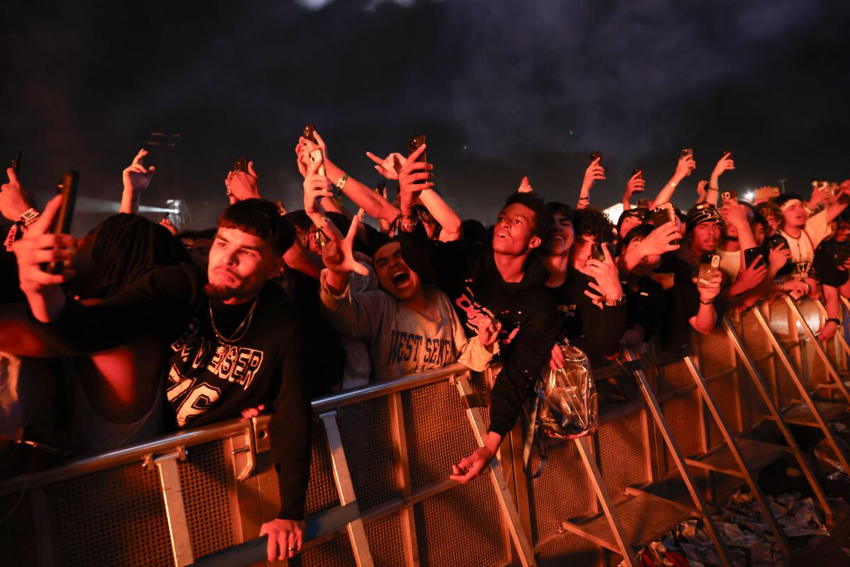People ticker arsenic Playboi Carti performs astatine Rolling Loud.