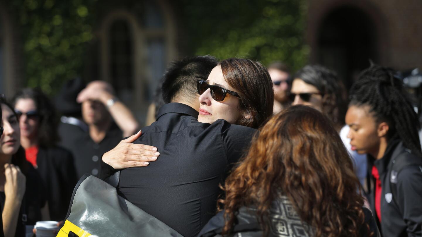 USC graduate student Helga Mayzar hugs fellow mourners after speaking at a ceremony honoringprofessor Bosco Tjan.