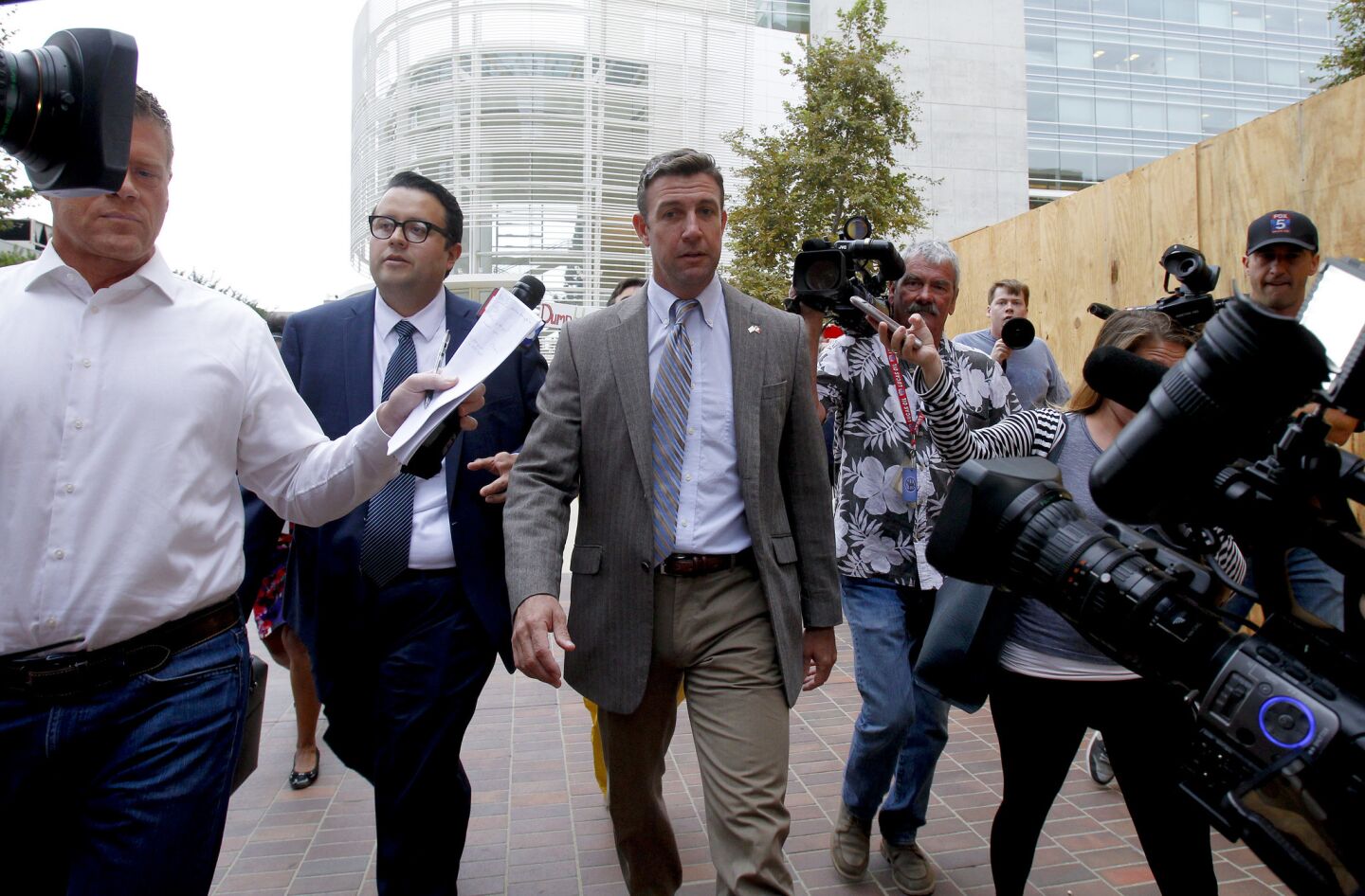 Congressman Duncan Hunter leaves San Diego federal court Monday morning where he and his wife, Margaret Hunter, appeared for a status hearing. They are charged with misspending political donations on personal items.