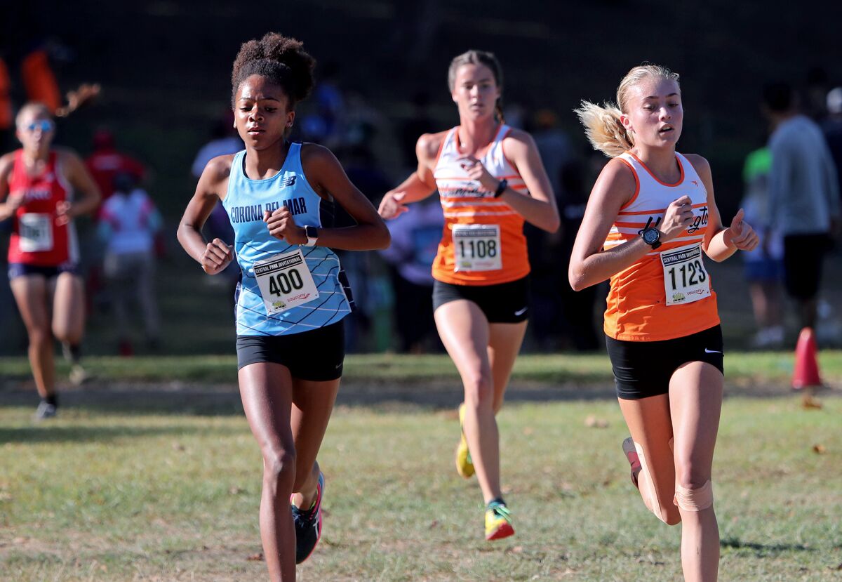 Corona del Mar's Melisse Djomby Enyawe (400) competes against Huntington Beach's Quinn Roldan (1123) and Claire Lewis (1108).
