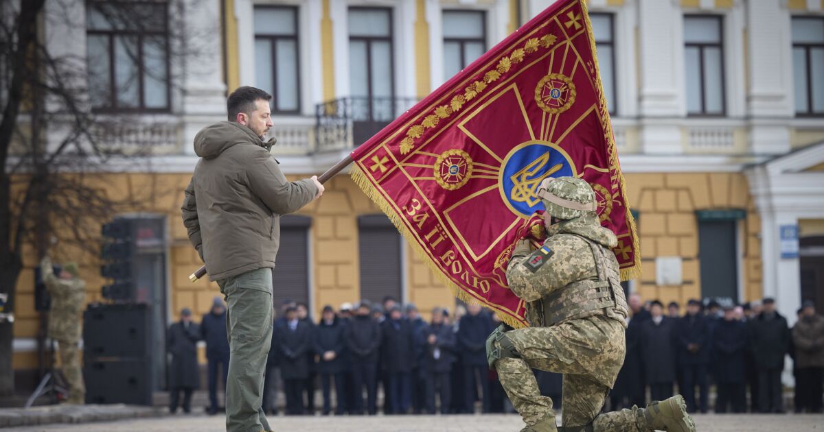 Grief, pride and a vow to win: Ukraine marks a year of war