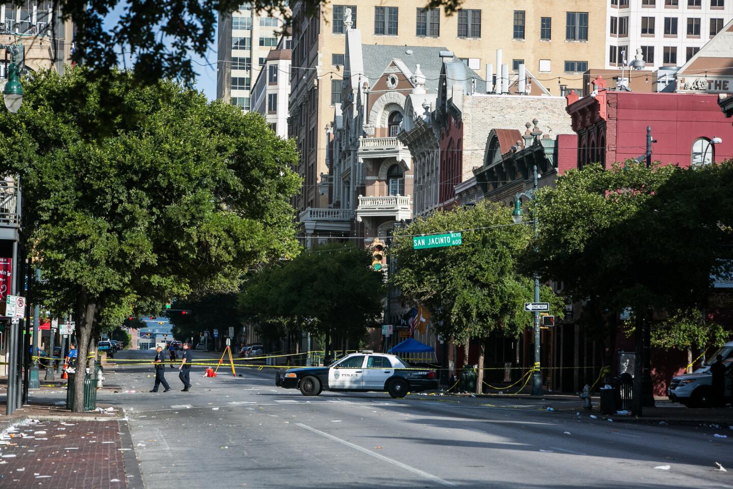 Police block off an area of 6th Street after two shootings July 31, 2016, in downtown Austin, Texas.