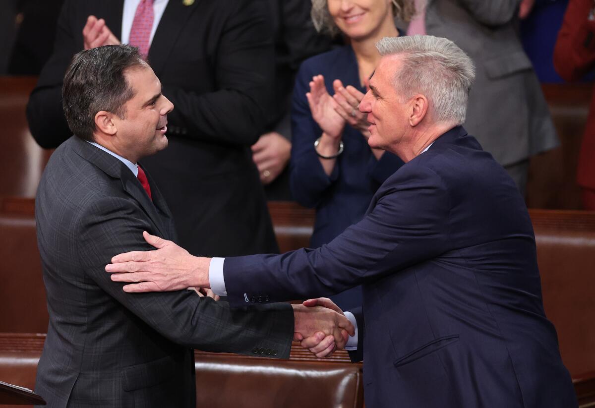 House Republican Leader Kevin McCarthy shakes hands with Rep.-elect Mike Garcia of California on Jan. 6, 2023. (