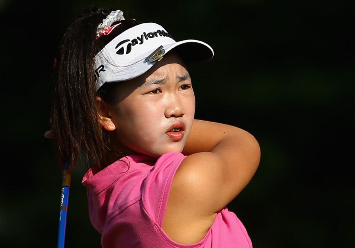 Lucy Li, 11, of Redwood Shores, Calif., hits a tee shot during a practice round Wednesday prior to the start of the U.S. Women's Open in Pinehurst, N.C.