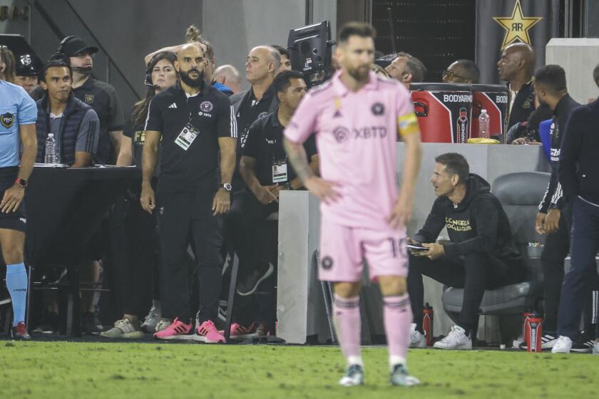Bodyguard Yassine Chueko, left, keeps watch Inter Miami's Lionel Messi during an MLS soccer match between the Inter Miami CF and the Los Angeles FC Sunday, Sept. 3, 2022, in Los Angeles. (Photo by Ringo Chiu / For The Times)
