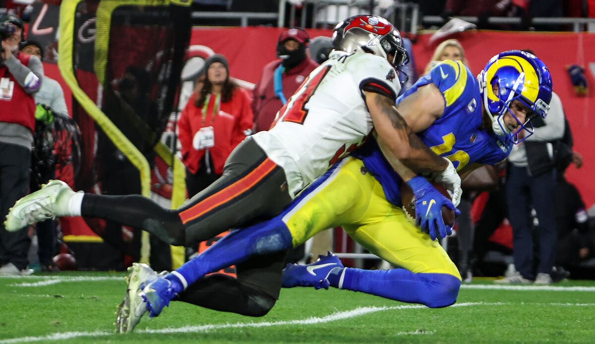 Rams wide receiver Cooper Kupp is tackled by Buccaneers safety Antoine Winfield Jr. after making a 44-yard catch.