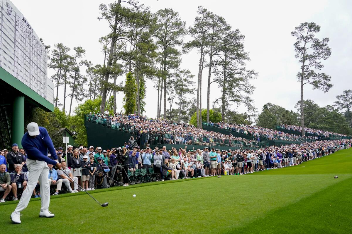 Tiger Woods hits from the 14th tee during a practice for the Masters golf tournament.