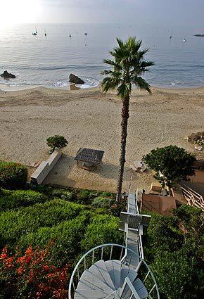 The McNamees retired to their bluff-top home overlooking a stunning stretch of Corona Del Mar State Beach near Inspiration Point. Their barbecue area is in apparent violation of the Coastal Act, but theyre crossing their fingers for their current appeal.