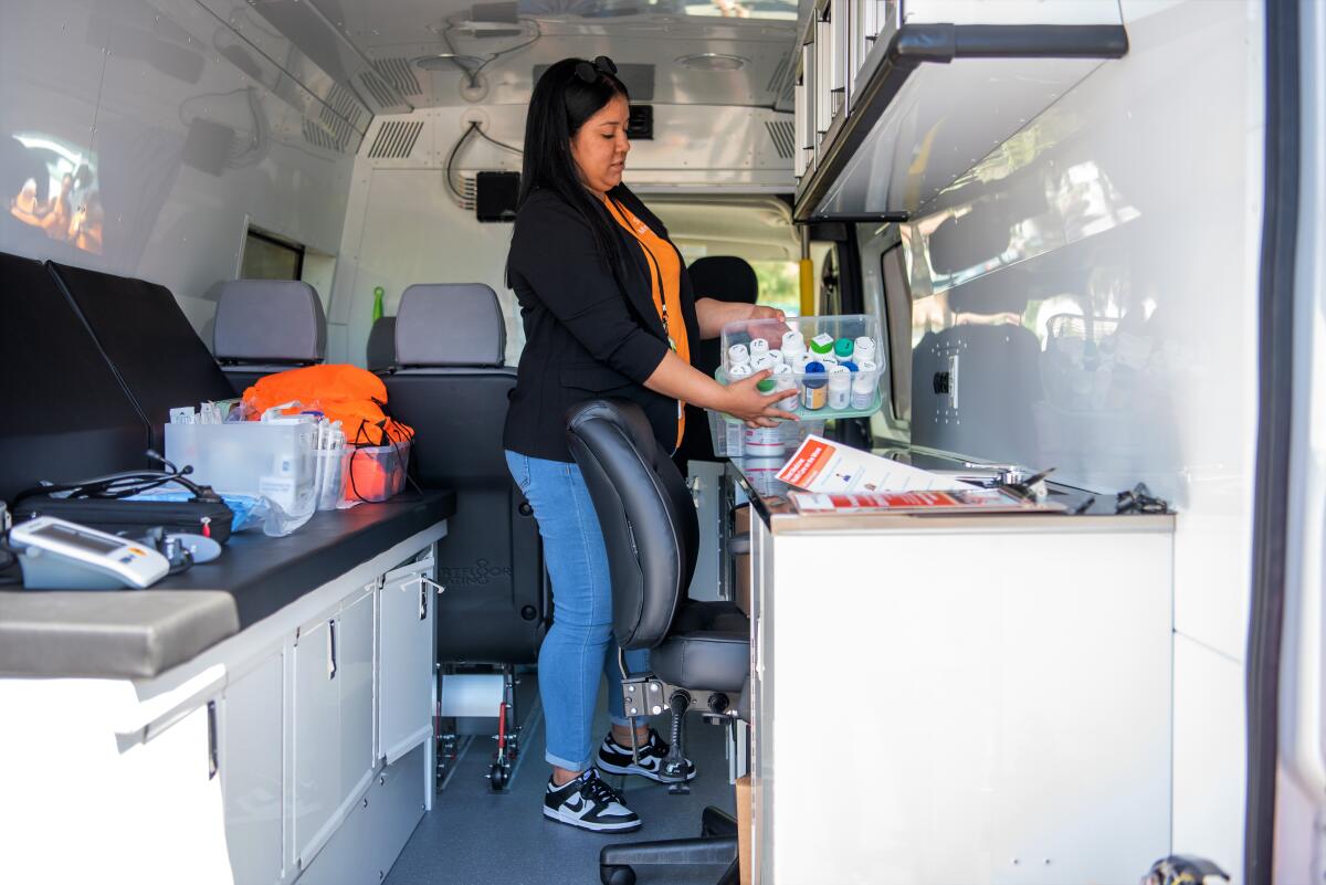 LVN Kimberly Tobon on Wednesday shows off a fully stocked street medicine van in Costa Mesa.