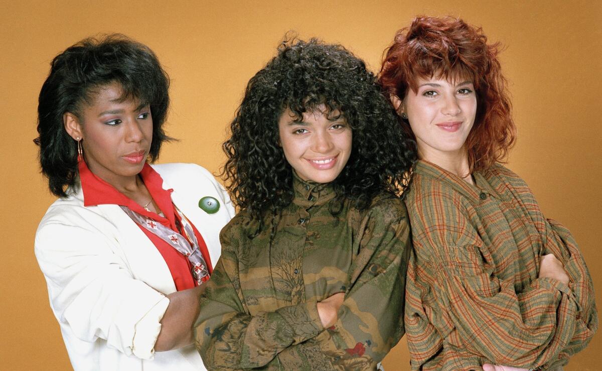 A promotional photo for the first season of "A Different World" shows actresses Dawwn Lewis, Lisa Bonet, and Marisa Tomei.