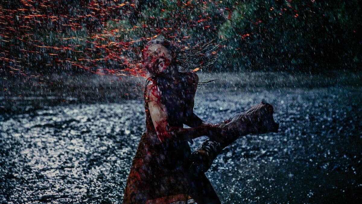Emily Browning uses her character's severed arm as a weapon in "American Gods." (Jan Thijs / Starz)