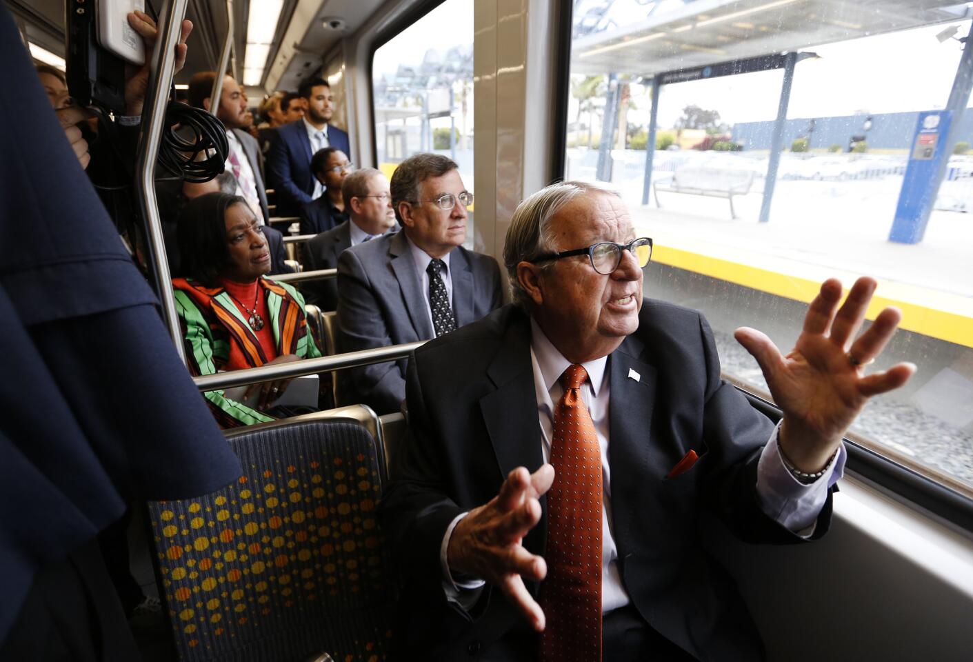 Los Angeles County Supervisor Don Knabe, right, talks to fellow Metro board members Jacquelyn Dupont-Walker and John Fasana as they ride an Expo Line test train between the Culver City Station and downtown Santa Monica on May 9.