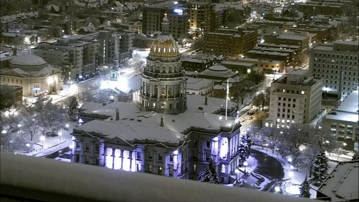 The Colorado Capitol in Denver is covered in snow early Thursday.