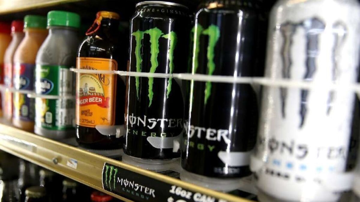 Cans of Monster Energy drink are displayed on a shelf at a convenience store. A Riverside County jury this week found that the company was not liable for a Texas man's heart attack.