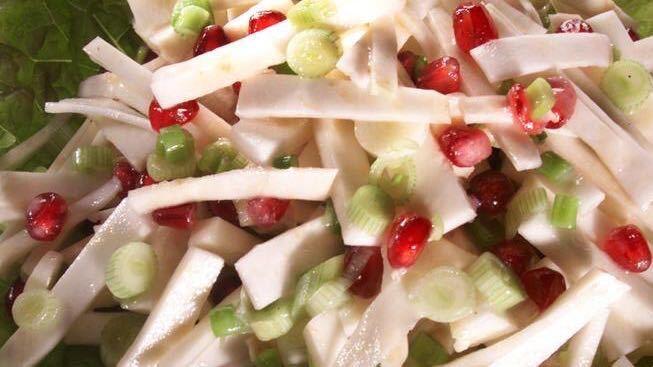 Celery root "slaw" with pomegranate seeds and green onions