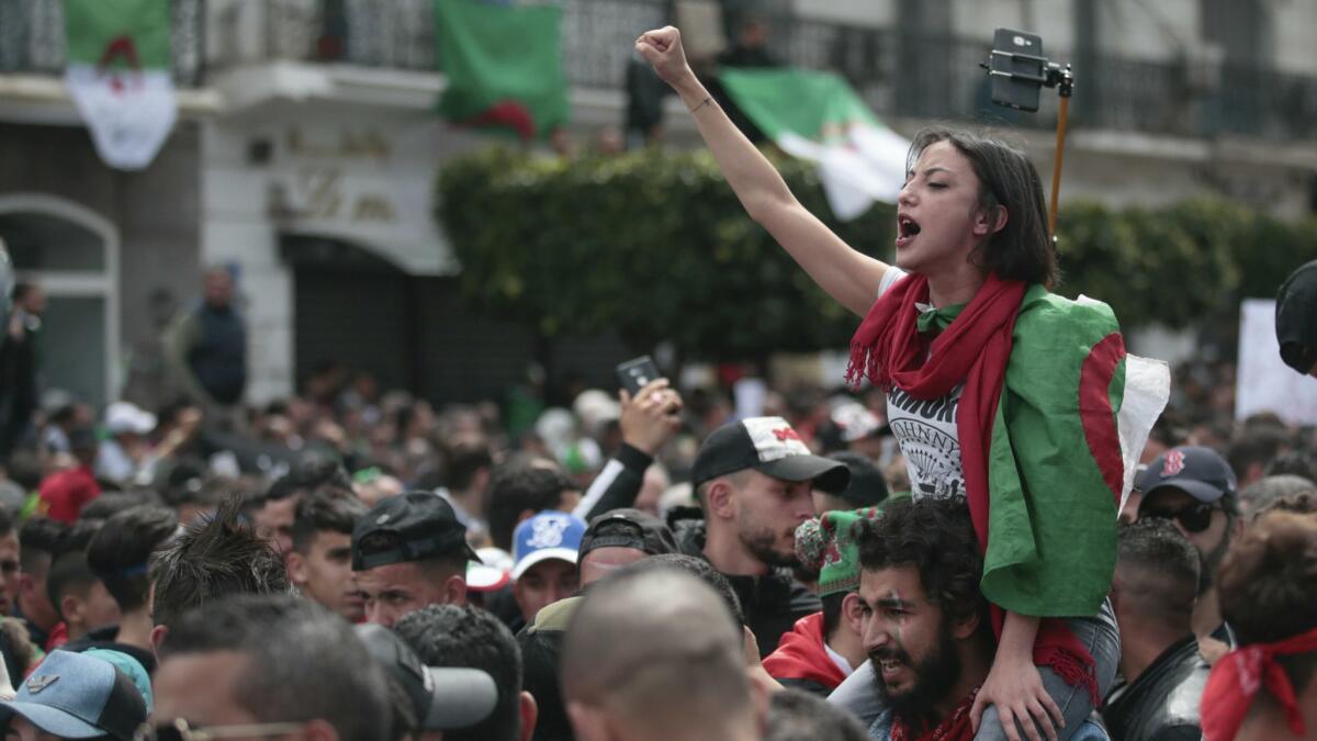 An Algerian protester chants slogans during a demonstration against the country's leadership in Algiers on April 12.