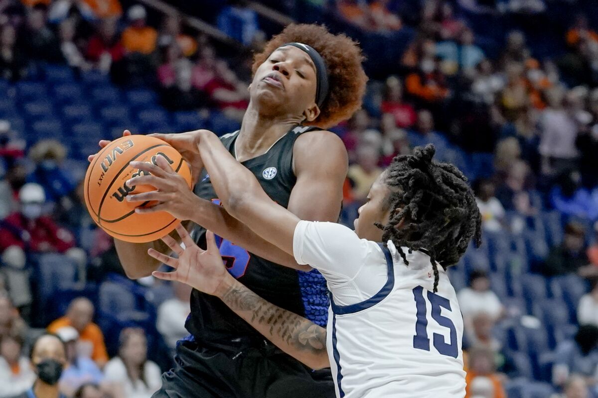 Florida's Nina Rickards, left, drives against Mississippi's Angel Baker (15) in the first half of an NCAA college basketball game at the women's Southeastern Conference tournament Friday, March 4, 2022, in Nashville, Tenn. (AP Photo/Mark Humphrey)