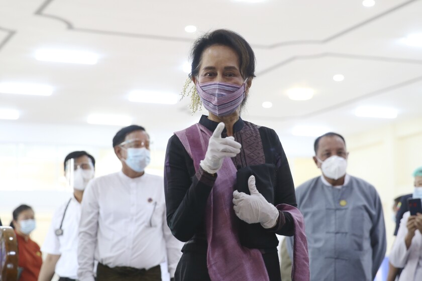 Myanmar leader Aung San Suu Kyi wears a face mask.