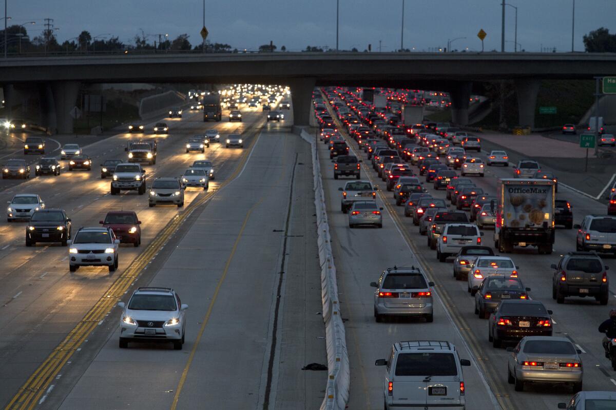 Motorists travel on the 405 Freeway through Costa Mesa last year.