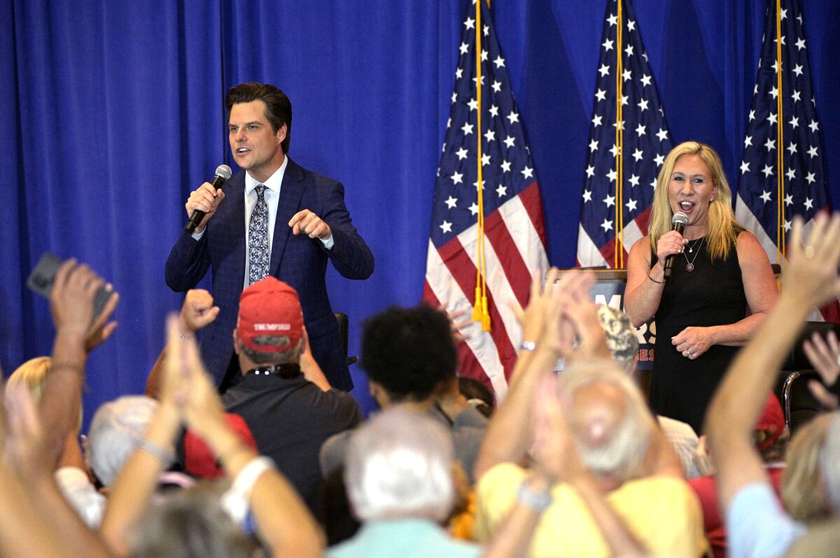 Reps. Matt Gaetz and Marjorie Taylor Greene in front of a crowd
