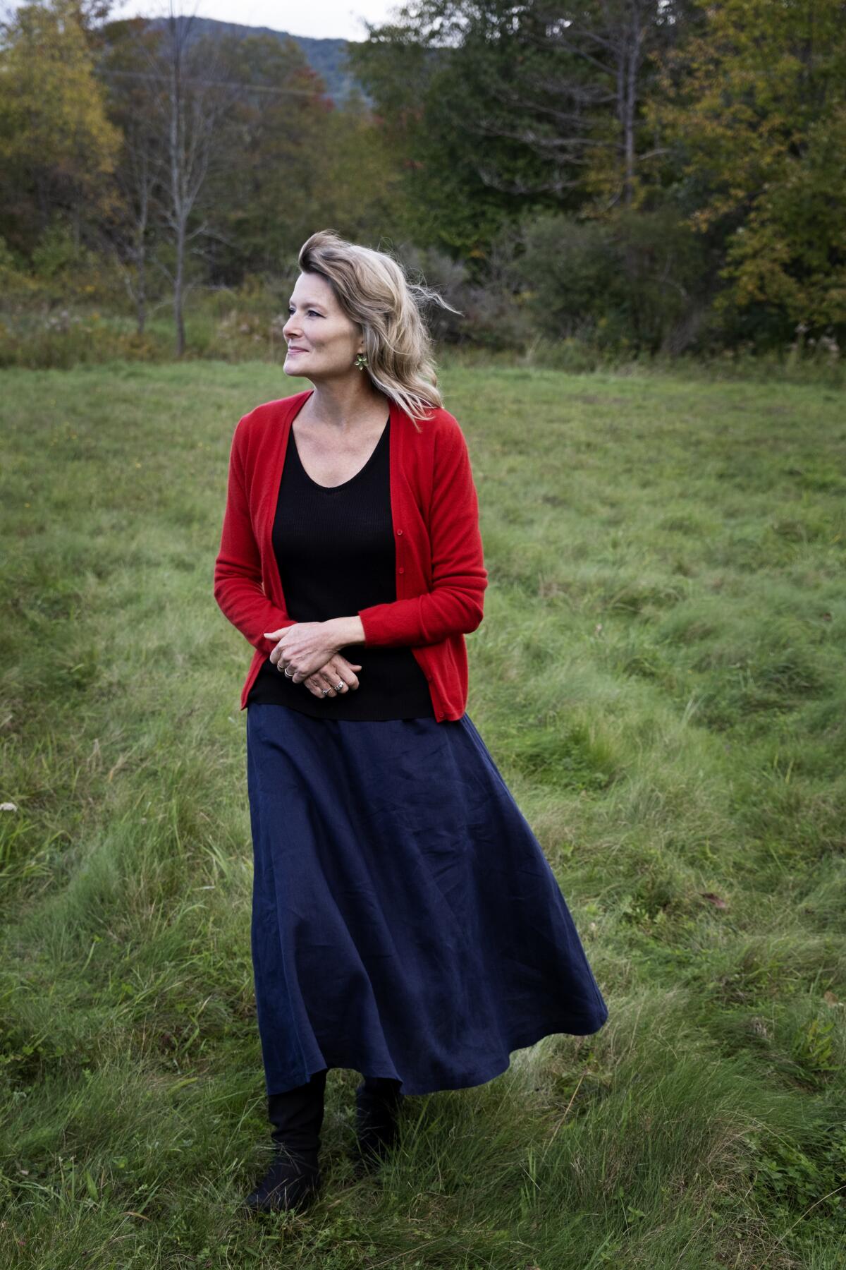 Jennifer Egan, the Pulitzer Prize-winning author of "A Visit From the Goon Squad," stands in a field with trees. 