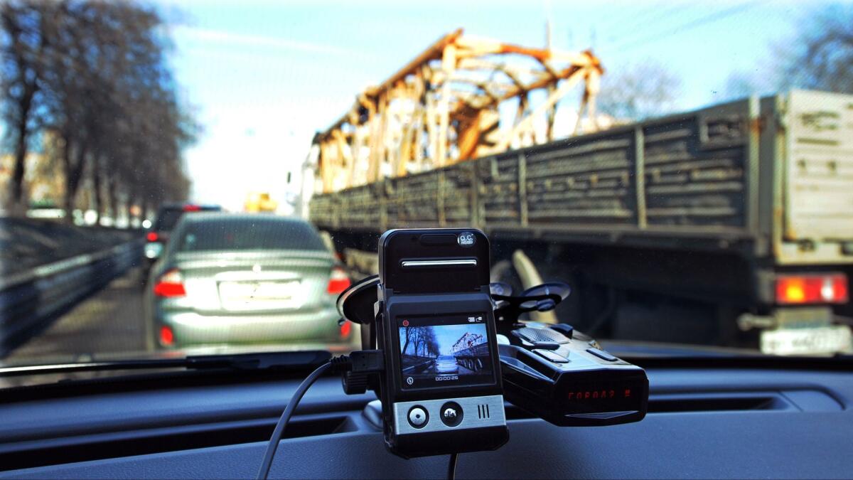 This file photo taken on March 13, 2013, shows a mini camera with a screen placed on a dashboard of a car rolling along a street in Moscow.