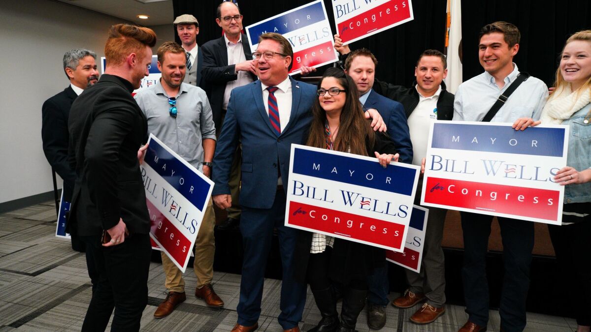 After his announcement for his candidacy for the 50th Congregational District, Bill Wells posed for photos with friends and supporters.