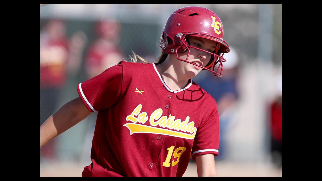 La CaÃ±ada High softball player #19 Devyn Cox rounds first base on her way to a double in away game vs. Monrovia High, in Monrovia on Friday, April 20, 2018.