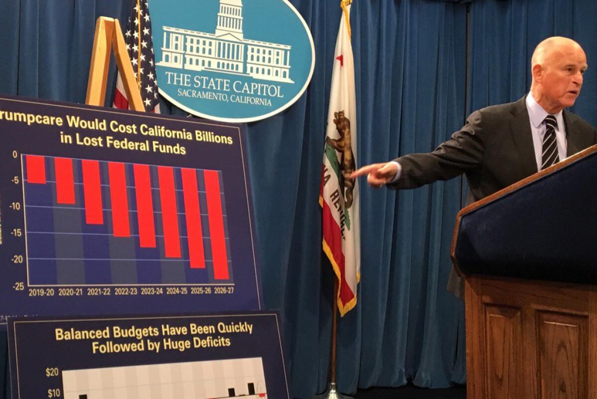 Gov. Jerry Brown unveils his revised state budget on Thursday at the state Capitol.