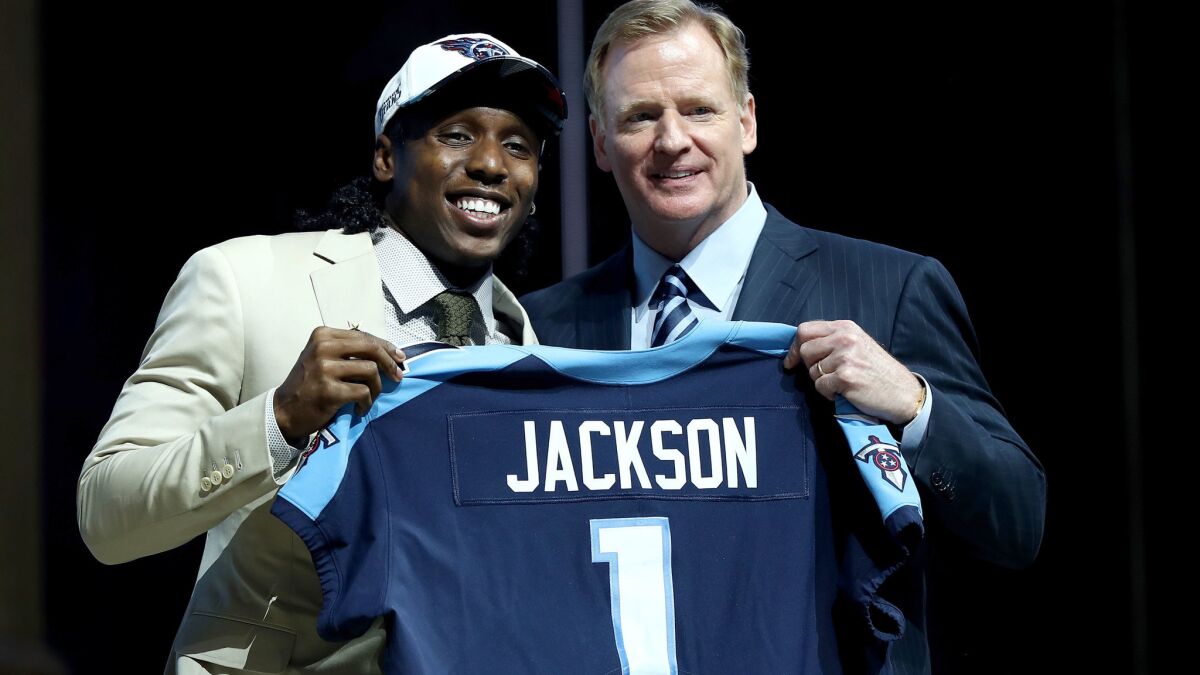 USC cornerback Adoree Jackson poses with NFL commissioner Roger Goodell after being picked by the Tennessee Titans during the first round of the draft.