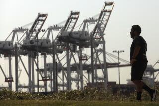 SAN PEDRO CA. AUGUST 27, 2020 - A man walks along the Wilmington Waterfront Park against a backdrop of cranes at the Port of Los Angeles on August 28, 2020. California air quality officials are poised to adopt their biggest pollution-cutting regulations in more than a decade, targeting diesel trucks and cargo ships that spew much of the state's cancer-causing and smog-forming emissions. The state Air Resources Board is expected to vote after a public hearing Thursday on two rules: one to establish stringent new emissions standards for heavy-duty diesel trucks and one to reduce pollution from ships docked at ports. (Genaro Molina/Los Angeles Times)