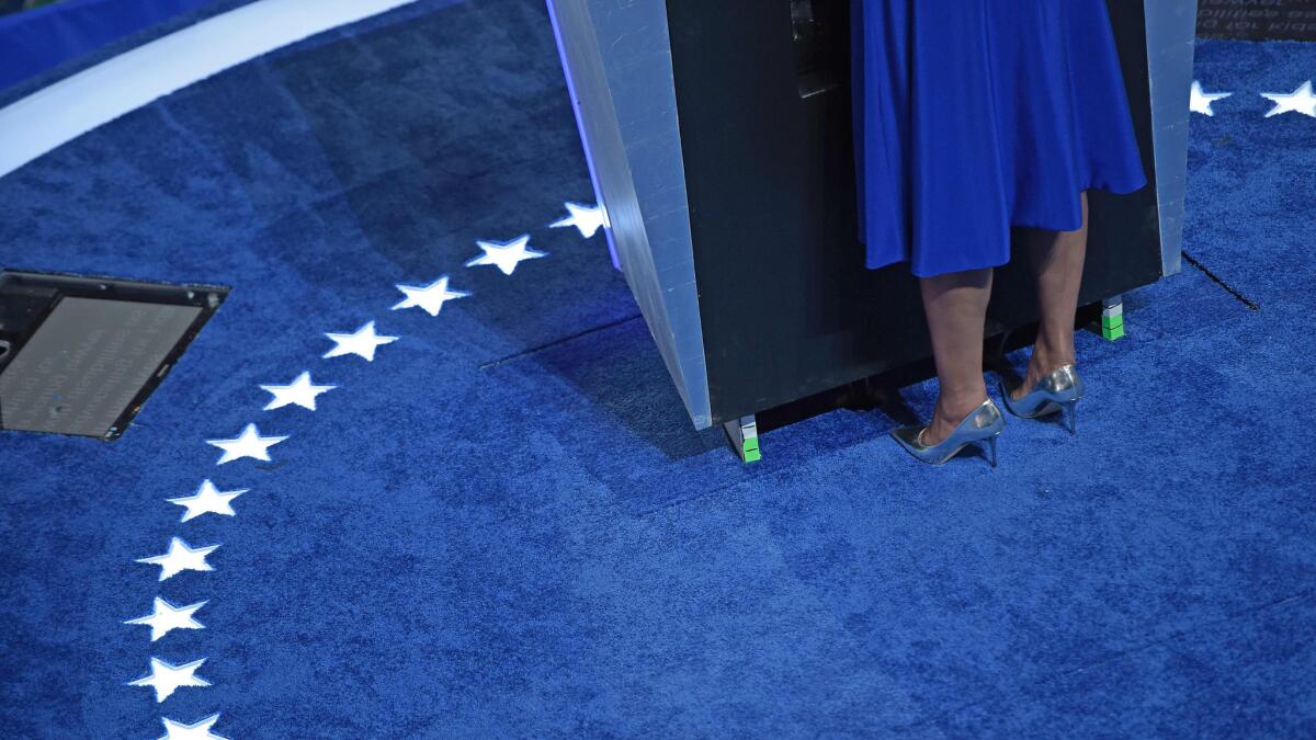 According to Footwear News, Michelle Obama chose to deliver her convention speech in a pair of metallic Jimmy Choo pumps.