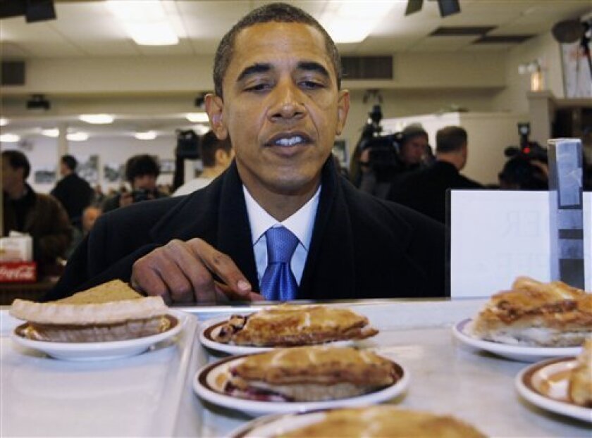 President-elect Barack Obama orders a slice of pie during a visit to Manny's Deli in Chicago, Friday, Nov. 21, 2008. (AP Photo/Charles Dharapak)