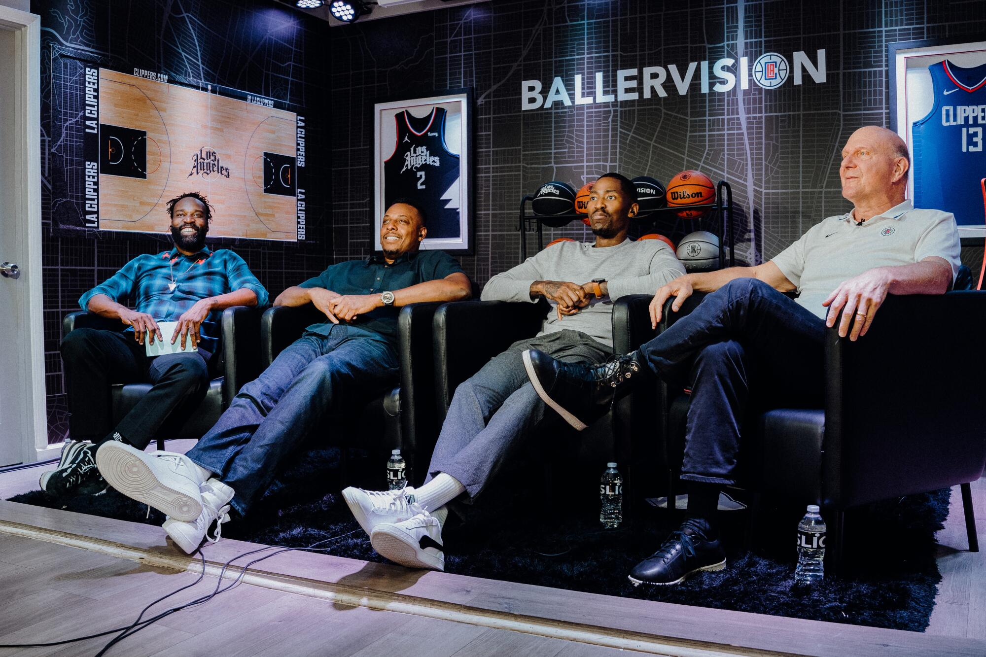 Former NBA players (from left) Baron Davis, Paul Pierce and Jamal Crawford sit in a studio with Clippers owner Steve Ballmer.