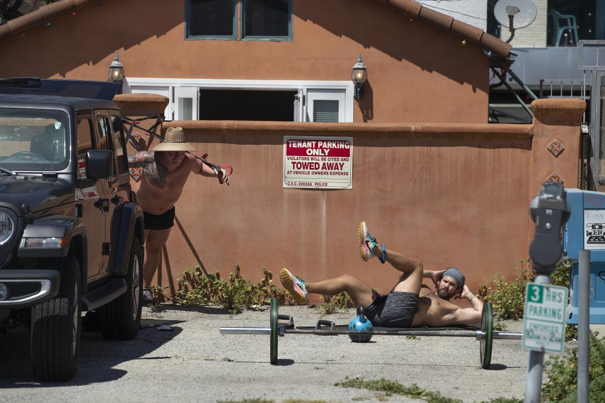 Ty and Randy Renner do a circuit training workout outside their house