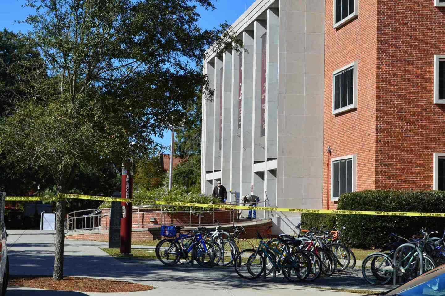 Crime scene tape is seen in front of the library at Florida State University, in Tallahassee, Florida, November 20, 2014. Three students were shot and wounded when a gunman opened fire inside the main Florida State University library early on Thursday, and campus police shot the suspect dead, officials said.