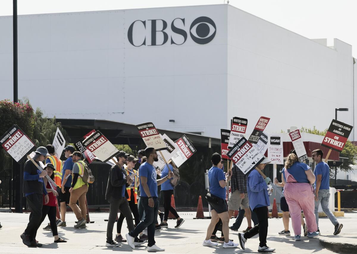 Members of the WGA picket in front of CBS Television City on Sunday, Sept. 24, 2023, in Los Angeles.