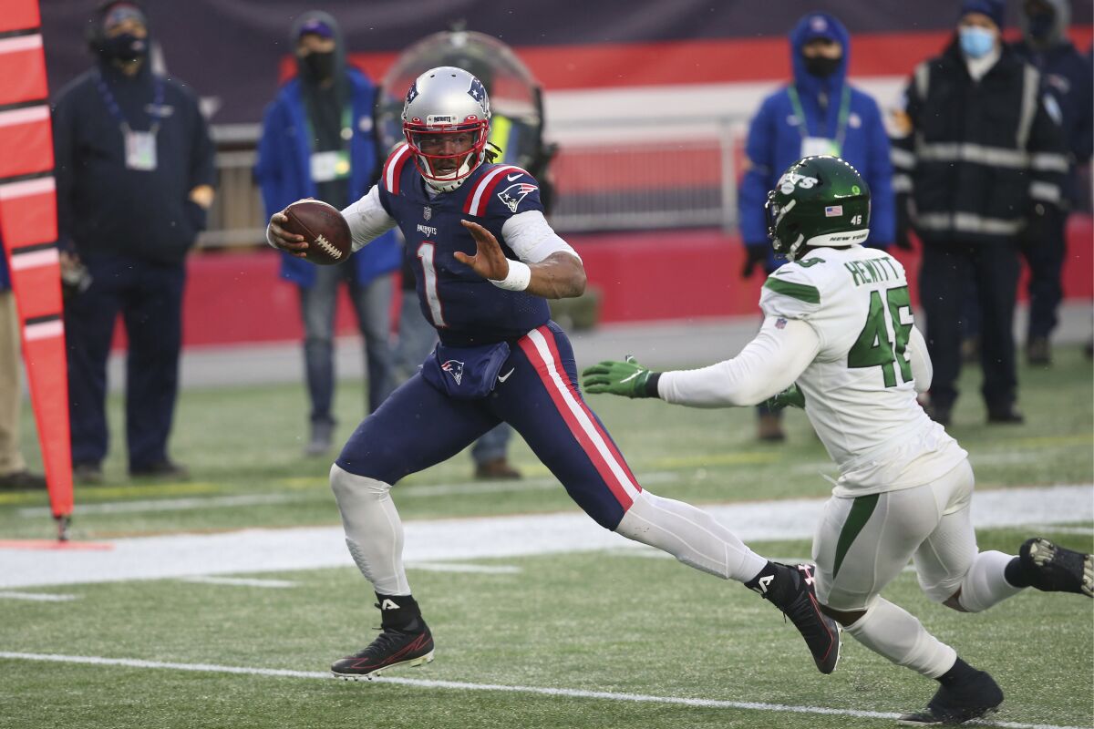 New England Patriots quarterback Cam Newton runs for a touchdown after a reception against the New York Jets.
