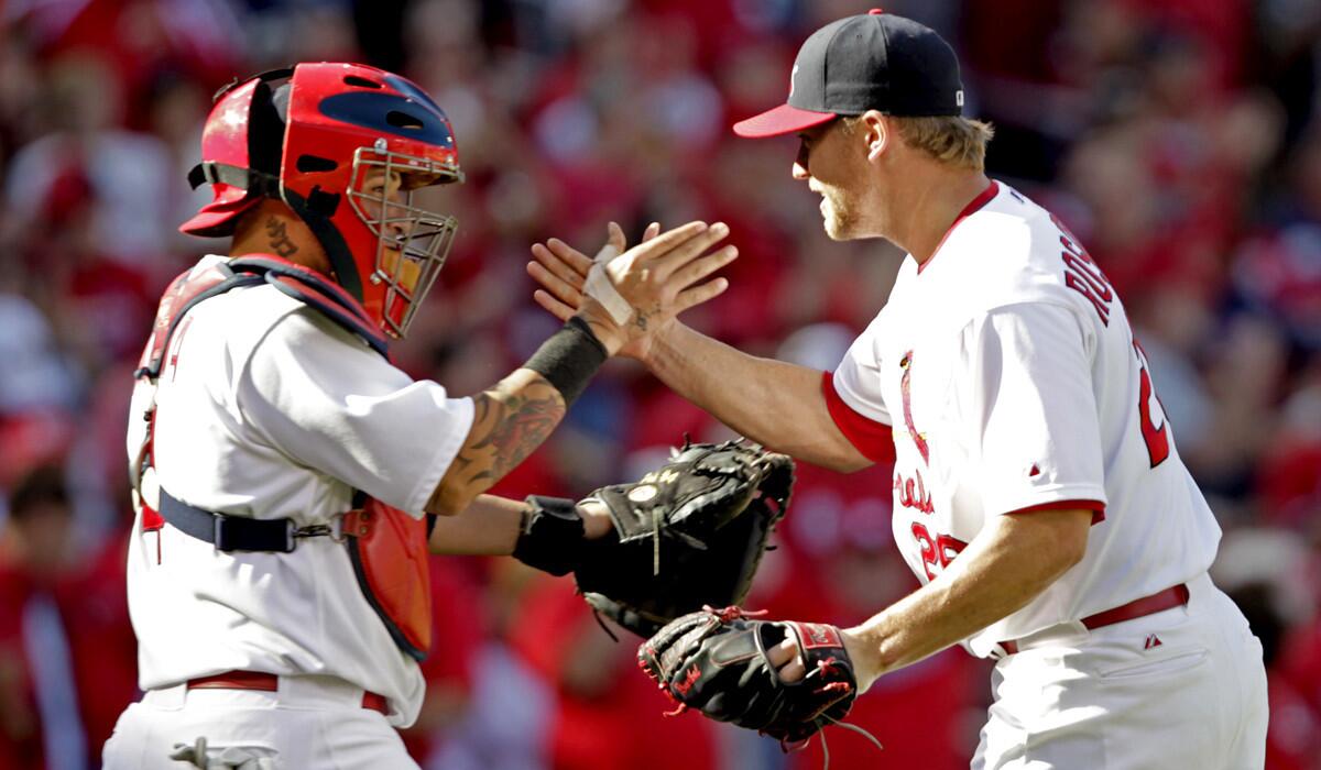 Cardinals catcher Yadier Molina, possibly the best in the game, and closer Trevor Rosenthal, who anchors a top-flight St. Louis bullpen, celebrate a victory over the Colorado Rockies last week.