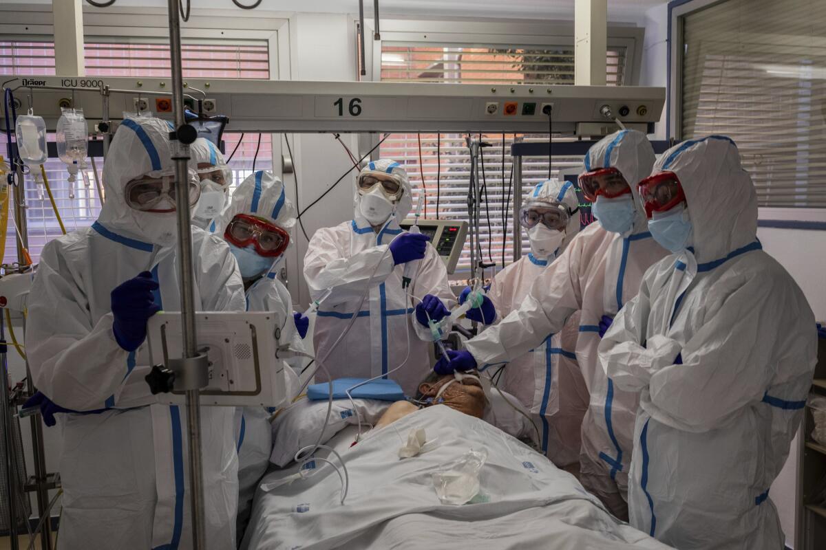 A COVID-19 patient is treated in an intensive care unit in Leganes, Spain.