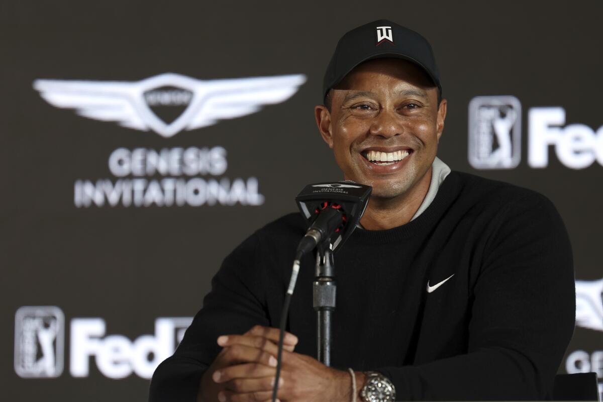 Tiger Woods speaks during a news conference for the Genesis Invitational golf tournament.