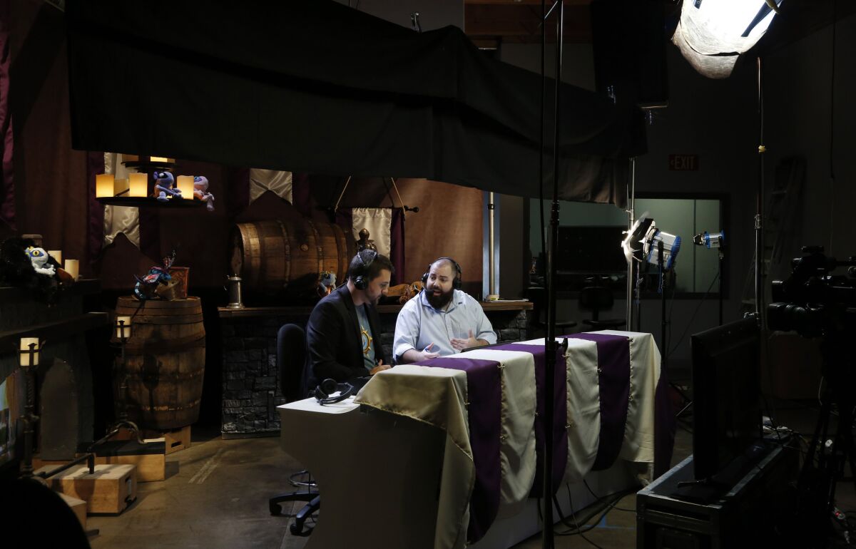 TJ Sanders, left, and Nathan Zamora, right, chat on camera during a live broadcast from ESL's North American headquarters in Burbank.